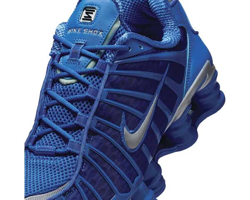 running in a marina area shoes Nike Shox TL "Hyper Royal"