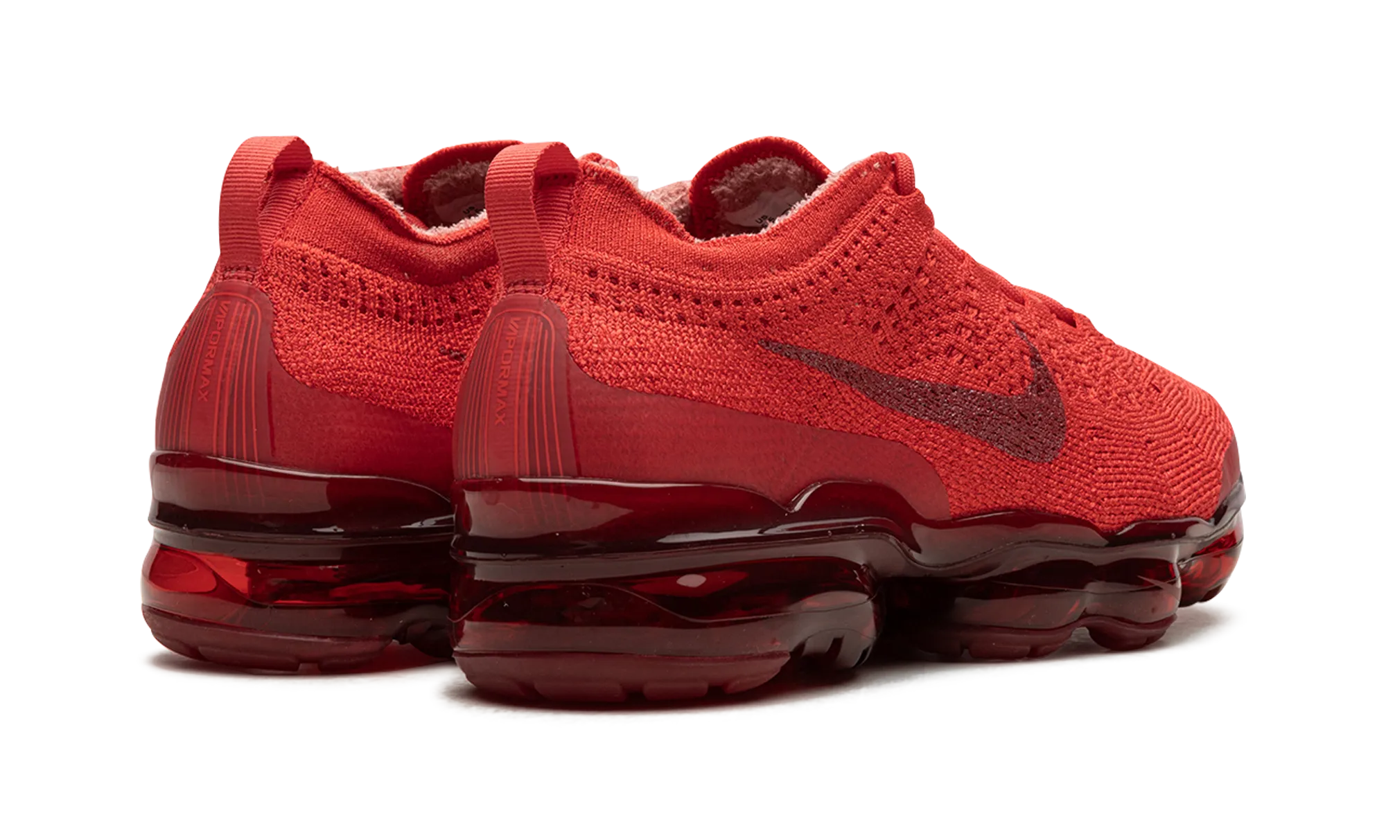 Air Vapormax 2023 Flyknit "Track Red" running in a snow - covered area shoes pom - pom - decorated running shoes